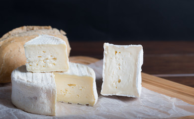 cheese on wooden plank