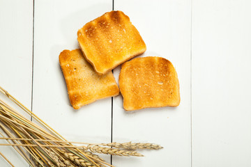 Toasts on a white wooden background