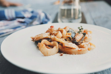 Traditional italian seafood pasta with calamari and mussel