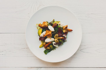 Traditional italian seafood salad with shrimps and mozzarella