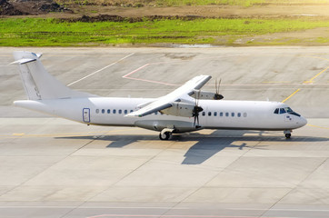 Passenger turboprop airplane taxi for takeoff at the airport