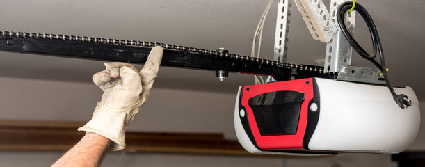 Testing the chain tension on a garage door opener