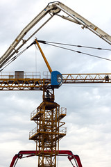 Industrial construction cranes and building silhouettes