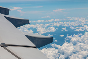 Wing aircraft and clouds in the sky.