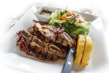 grilled rib steak with salad and sticky rice thai spicy sauce