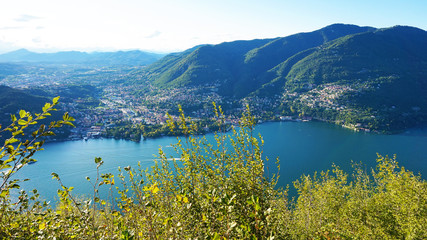 Como Lake landscape. Cernobbio village, trees, water and mountains. Italy, Europe.