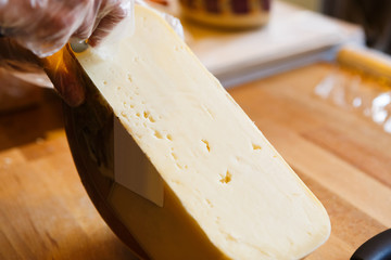 Gouda cheese closeup, cheese background