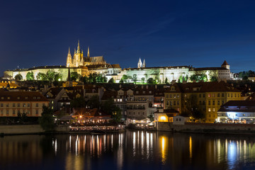 Fototapeta na wymiar View of the lit Prague (Hradcany) Castle and other buildings at the Mala Strana (Lesser Town) district in Prague, Czech Republic, at night.