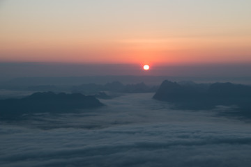 Sunrise on the mountains and fog background.