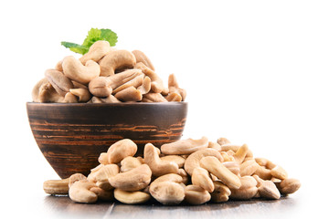 Bowl with cashew nuts isolated on white