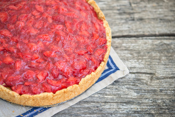 Rustic strawberry cake on wooden table