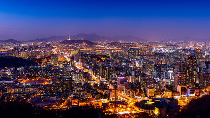 Fototapeta na wymiar Seoul cityscape and Seoul tower at night. Traffic in Seoul, South Korea.