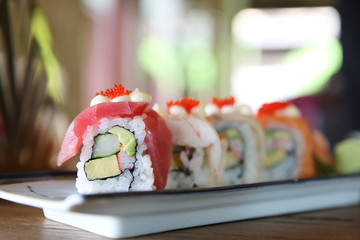 mix sushi rolls with tuna salmon shrimp sushi maki , japanese food