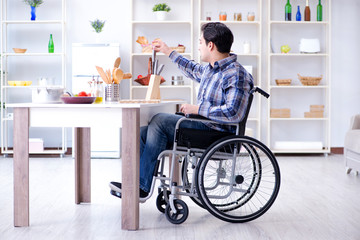 Disabled young man husband working in kitchen
