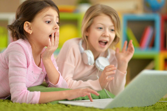 little girls using laptop 