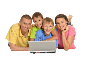 Parents with sons using laptop