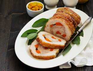 Fried pork loin stuffed with carrots and garlic. Festive dish.
