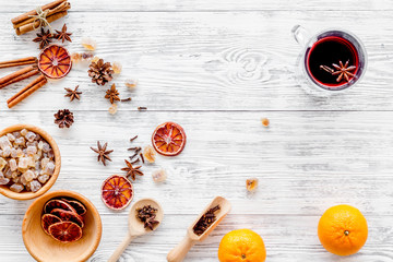 Celebrate new year winter evening with hot drink. Mulled wine or grog ingredients. White background top view.