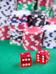 cubes and poker chips on green table