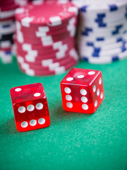 cubes and poker chips on green table