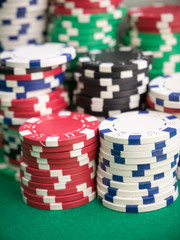 stacks of poker chips on green table
