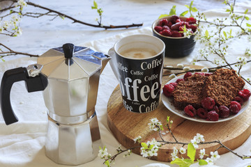 Spring breakfast. Banana bread with raspberry and cup of fresh coffee