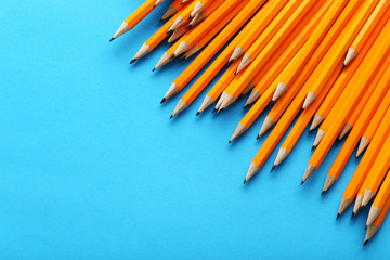 Yellow pencils on a blue background