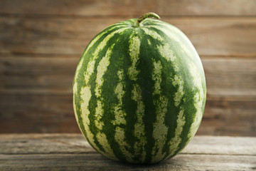 Watermelon on grey wooden table