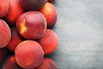 Sweet nectarines fruit on grey wooden table