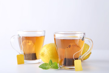Cup of tea with teabag on a white background