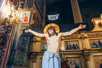  crucifixion of Jesus Christ on the background of the altar in the church or the cathedral, symbol...