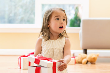 Little girl opening a Christmas present box