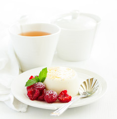 Delicious home-made dessert Panna cotta. Cream-caramel, caramel custard, with raspberries.