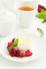 Delicious home-made dessert Panna cotta. Cream-caramel, caramel custard, with raspberries.