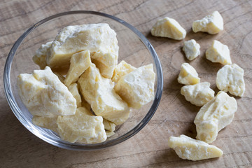 Pieces of cocoa butter in a glass bowl