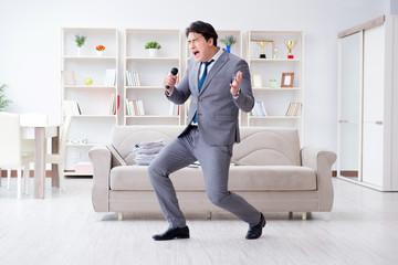 Drunk businessman celebrating in the office