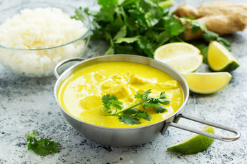 Yellow curry with chicken and rice. Asian cuisine.