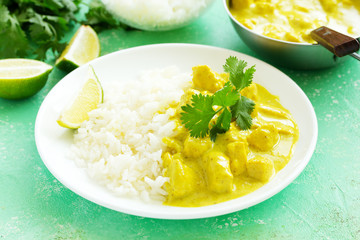 Yellow curry with chicken and rice. Asian cuisine.