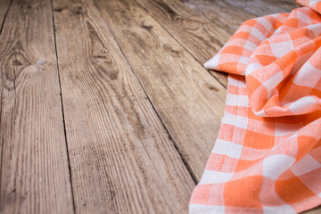 Cherckered napkin on the wooden background