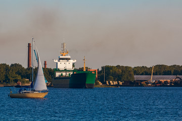 Green cargo ship in port