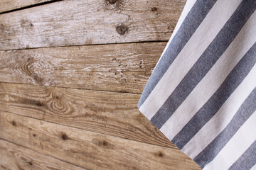 Fototapeta na wymiar Striped napkin on the wooden background