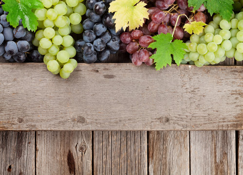 Grapes on wooden background