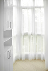 Fototapeta na wymiar Interior of light room with wardrobe