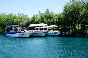 Fototapeta premium Berthed tourist boats on sunny summer day