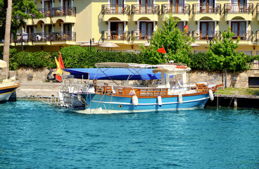 Fototapeta na wymiar Berthed motor boat on sunny summer day