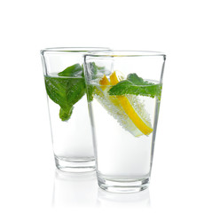 Two glasses with basil water, isolated on white