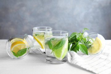 Basil water in glassware on table