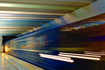 Background of motion blur of speed train in the subway. Underground vehicle dynamic motion.