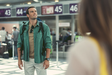 Attractive cute guy is waiting for flight