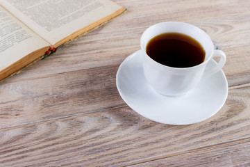 Cup of coffee on a wooden table